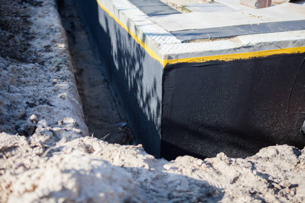 Professional Emergency Waterproofing technician working in Hamburg, MI